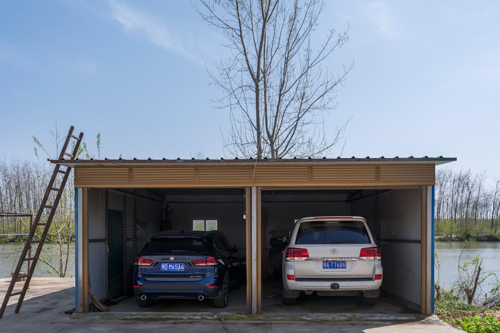 two cars in two garages